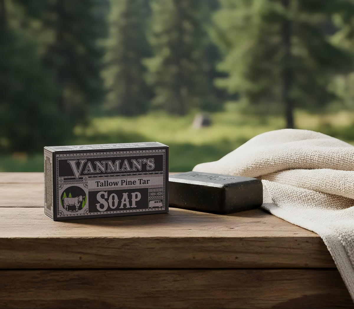 Vanman's Tallow Pine Tar Soap with packaging on a wooden surface outdoors.