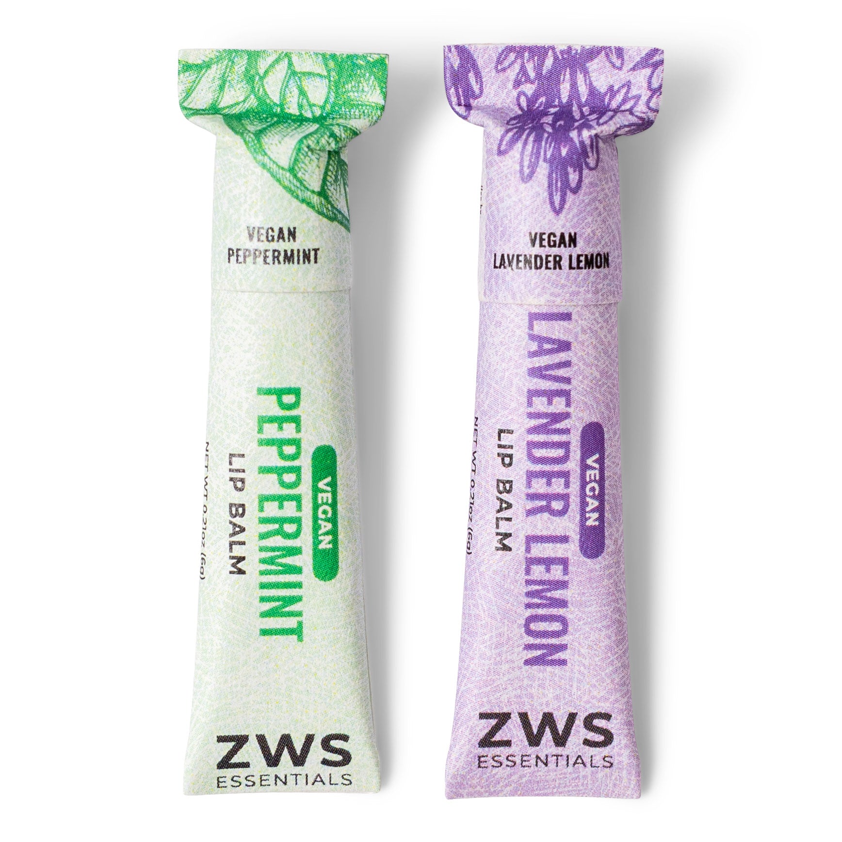 Two ZWS Essentials lip balm sticks, one peppermint and one lavender lemon, on a white background.