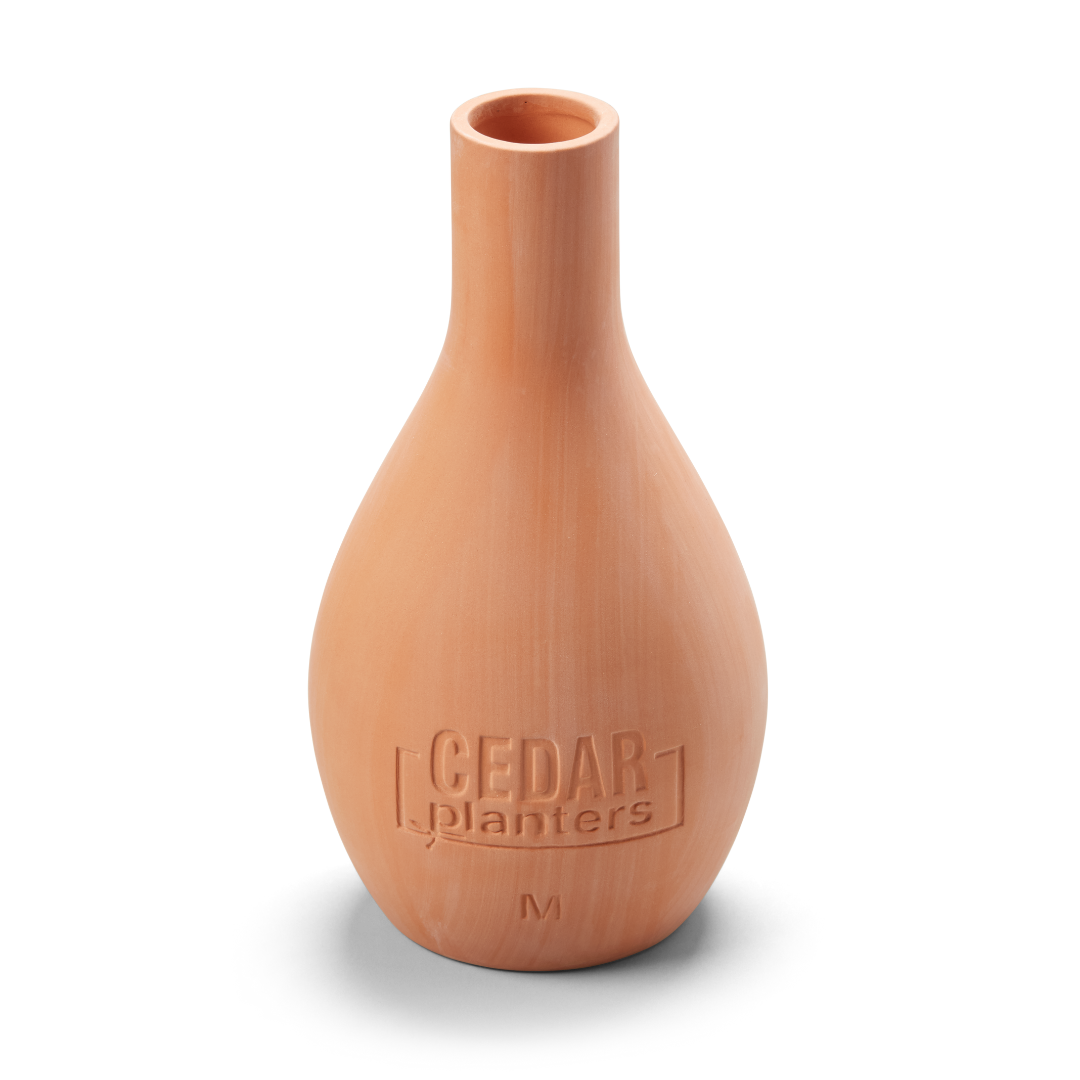 Wooden vase with 'Cedar Planters' branding on a white background
