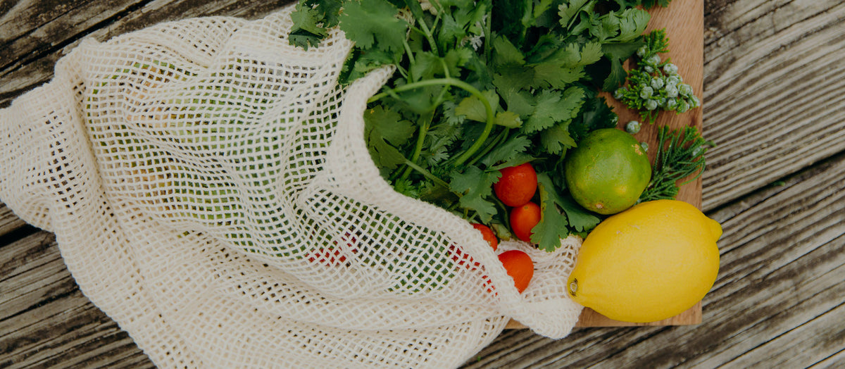 Premium Photo  Hand with an eco bag with vegetables.young hipster  lifestyle girl holding textile glocery bag with vegetables. zero waste food  shopping. eco natural concept