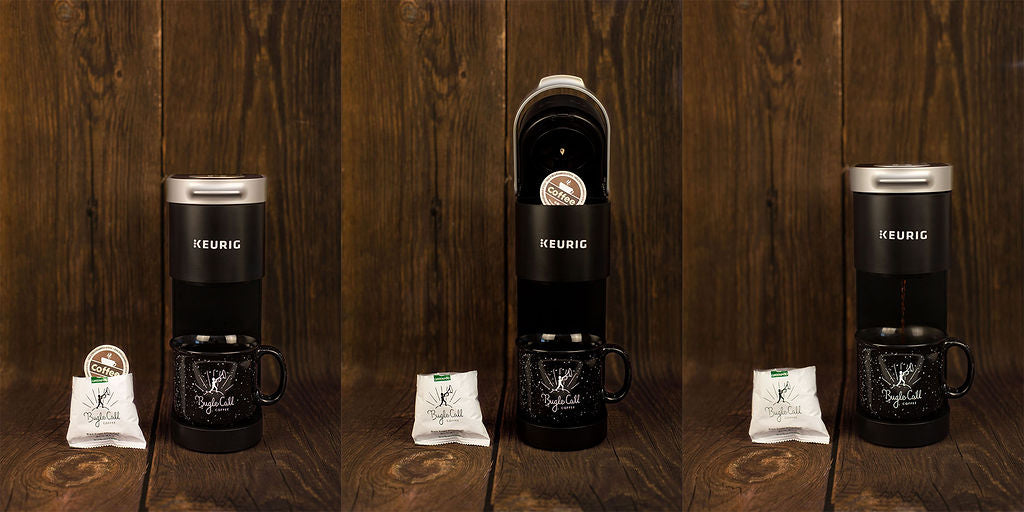 Three black coffee makers with white labels on a wooden surface
