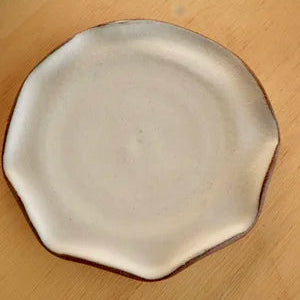 Octagonal ceramic plate on a wooden surface