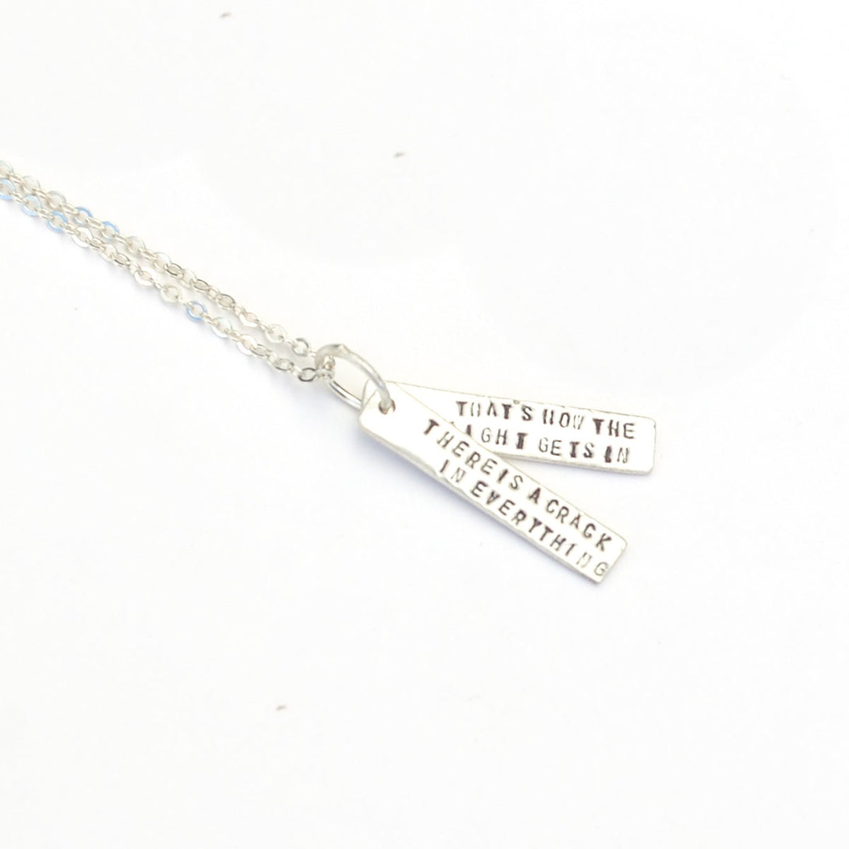 There's a crack in everything; that's how the light gets in - Leonard Cohen Quote Necklace
