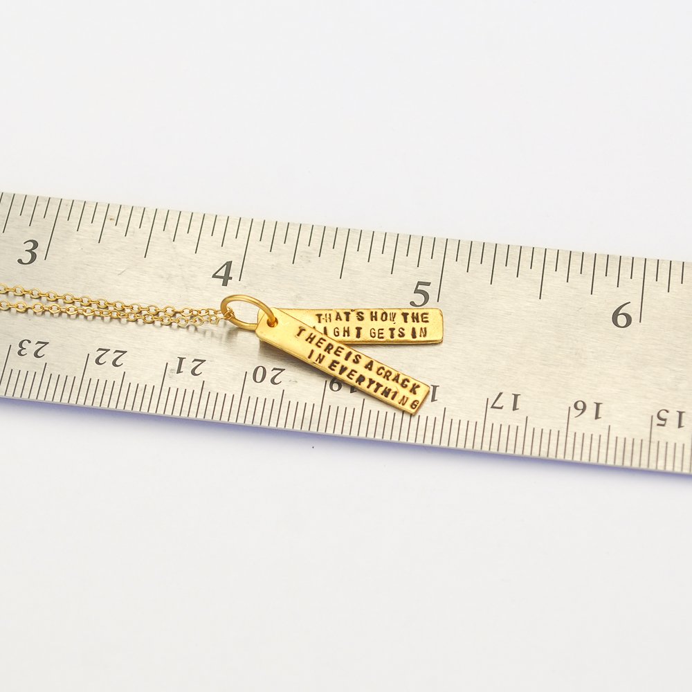 There's a crack in everything; that's how the light gets in - Leonard Cohen Quote Necklace