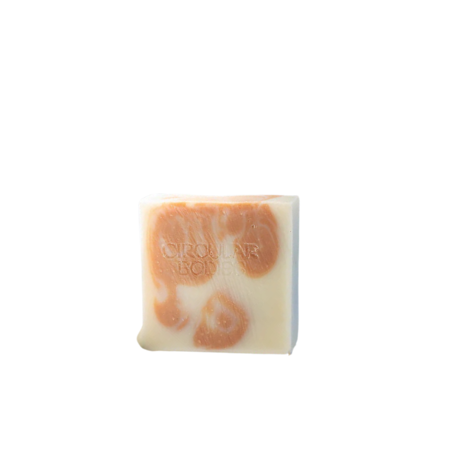 Bar of soap with orange swirls on a white background