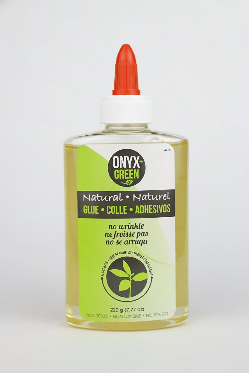 Bottle of Onyx Green glue with a red cap on a white background