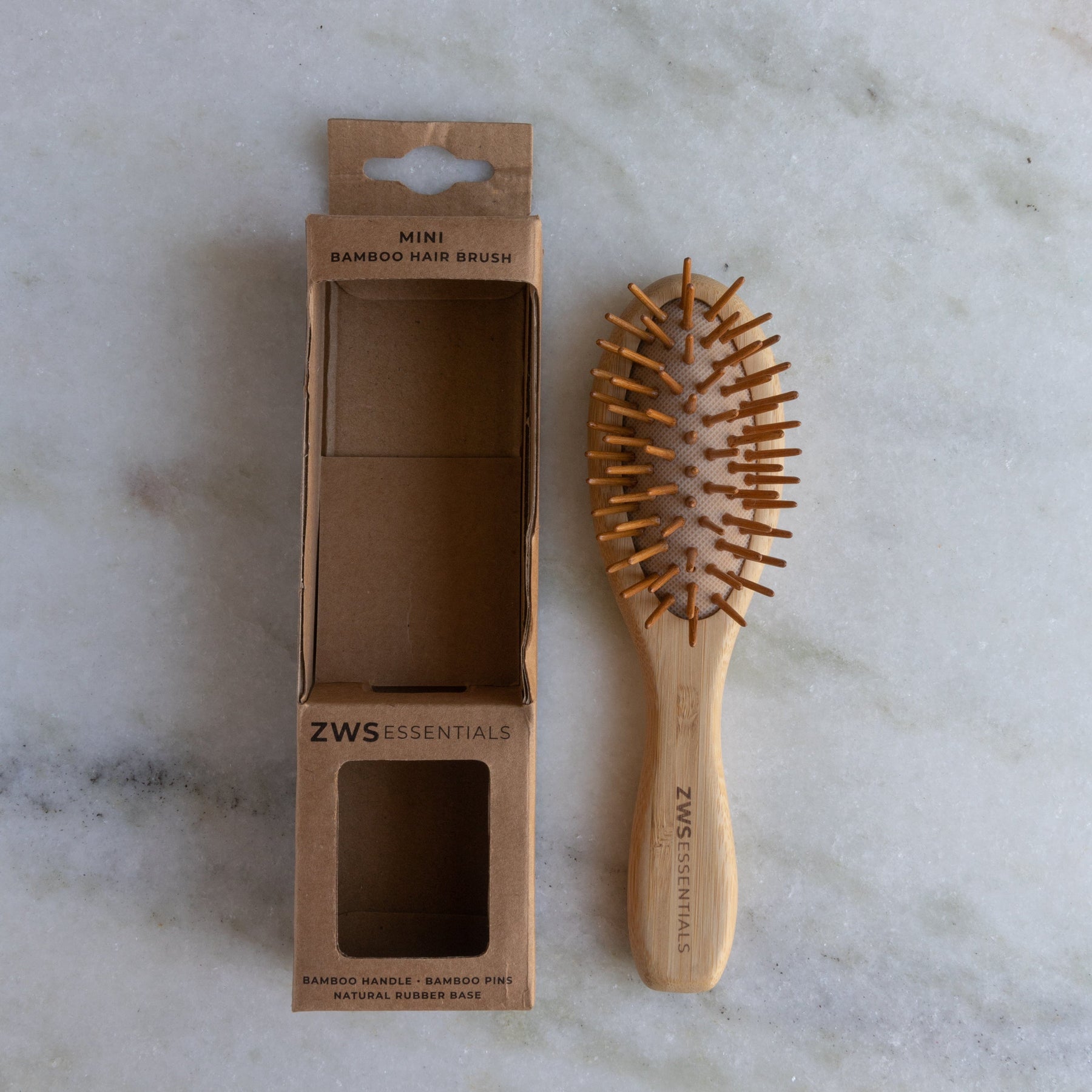 https://earthhero.com/cdn/shop/products/zws-essentials-mini-bamboo-hairbrush-zero-waste-hair-brush-100-bamboo-plastic-free-compostable-31899387560047_1800x.jpg?v=1698265739